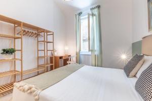 Postel nebo postele na pokoji v ubytování Craft-nel cuore di Siena