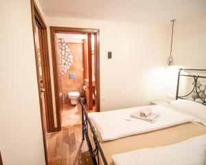 Postel nebo postele na pokoji v ubytování Vila Triglav on Pokljuka