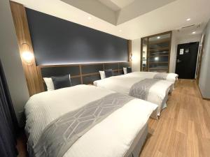 Postel nebo postele na pokoji v ubytování HOTEL SAILS