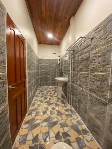 a bathroom with a toilet and a sink at Konglor Cave Resort in Ban O