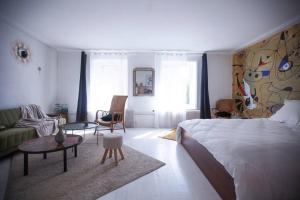 Posteľ alebo postele v izbe v ubytovaní Le gîte de la Cour des Arts