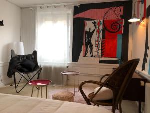 Posteľ alebo postele v izbe v ubytovaní Le gîte de la Cour des Arts