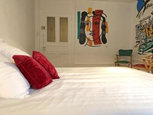 Posteľ alebo postele v izbe v ubytovaní Le gîte de la Cour des Arts