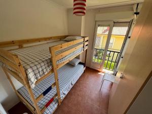 A bed or beds in a room at Apartamento Lagos Azules II