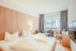 Letto o letti in una camera di Hotel Kendler