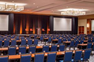 an empty lecture hall with desks and chairs at Hyatt Regency Crystal City at Reagan National Airport in Arlington