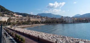 a view of a river with buildings and a beach at Appartamento Saragone in Salerno