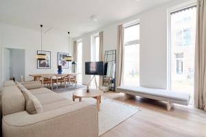 a living room with a couch and a table at Great Apt · Near Beach · CPH in Copenhagen