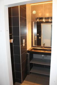 a bathroom with a sink and a mirror at Sagardi Zolan in Saint-Jean-de-Luz