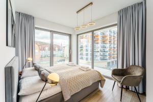 Posteľ alebo postele v izbe v ubytovaní Balticus 16A by Noclegi Renters