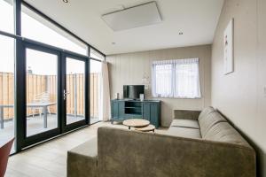 Χώρος καθιστικού στο Vakantiehuis Zonnig Zuid - Julianadorp aan Zee +16 φωτογραφίες