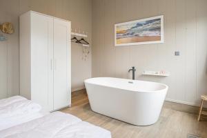 Ένα μπάνιο στο Vakantiehuis Zonnig Zuid - Julianadorp aan Zee