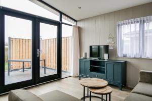 Μια τηλεόραση ή/και κέντρο ψυχαγωγίας στο Vakantiehuis Zonnig Zuid - Julianadorp aan Zee