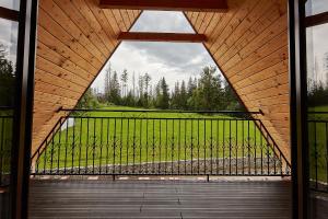 a view from the inside of a porch with a gate at Domek Apartament u Wilków na wyłączność Zakopane in Zakopane