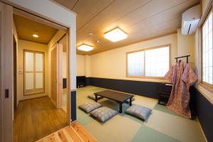 Postel nebo postele na pokoji v ubytování Ebisu Ryokan