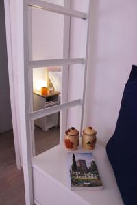 a book sitting on a white table with a ladder at Friends of Michelangelo in Florence