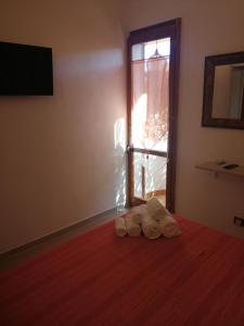 Posteľ alebo postele v izbe v ubytovaní Le Rocce Holiday Rooms