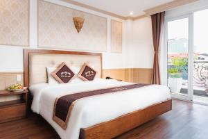 Ένα ή περισσότερα κρεβάτια σε δωμάτιο στο Roy Dala Hotel
