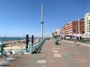 a pier with people walking on the beach at Brighton Studio Flats in Brighton & Hove