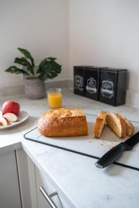 a loaf of bread on a cutting board on a counter at St George's Residence in Glasgow