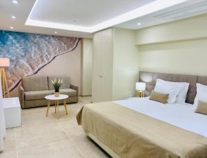 a bedroom with a large bed and a couch at Lagos Atlantic Hotel in Lagos