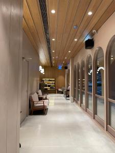 a hallway of a building with a ceiling at Inns Hotel in Kaohsiung