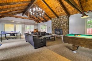 a living room with a pool table and ping pong ball at Cozy Oregon Resort Condo - Steps to Lincoln Beach! in Lincoln City