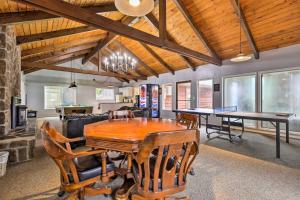 a dining room with a wooden table and chairs at Cozy Oregon Resort Condo - Steps to Lincoln Beach! in Lincoln City