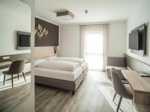 TV a/nebo společenská místnost v ubytování Motel Waidhofen an der Thaya