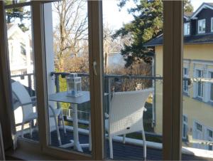 a view from a window of a balcony with a table at Villa Granitz - Ferienwohnung Kettelhoit in Göhren