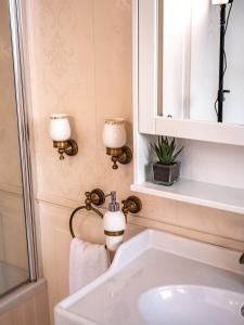 a bathroom with a sink and a mirror at Elegant Hvar town villa with pool in Hvar