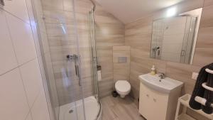 Kúpeľňa v ubytovaní Wrzosowe Wzgórze Apartamenty + 18 fotografií