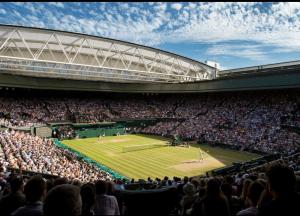 a crowd of people watching a tennis match in a stadium at Super Convenient 2 Double Bed apartment for Central London - 30 seconds walk to platform train station and 19 mins to London Waterloo in London