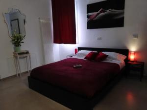 A bed or beds in a room at Sacripante