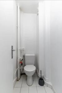 a bathroom with a white toilet in a stall at HSH Saint-Charles André-Citroën Superbe appartement 5P in Paris
