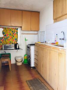 a kitchen with a sink and a stove top oven at Traditional House with Amazing Veranda in Bethlehem