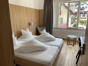 Letto o letti in una camera di Hotel Kendler