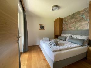 Posteľ alebo postele v izbe v ubytovaní Apartments Hohenberger Mallnitz - Mein Platz in den Bergen!