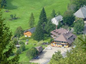 an aerial view of a large house with a parking lot at Akzent Hotel Lawine in Todtnau