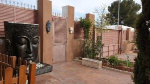 a house with a door with a face on it at Hacienda Cruz in Toledo