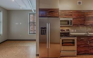 a kitchen with stainless steel appliances and wooden cabinets at Metropolitan at the 9 in Cleveland