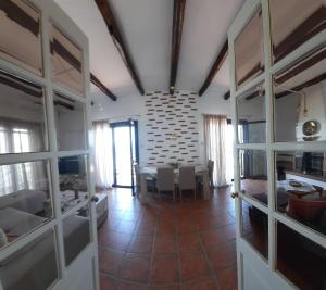a room with a table and a dining room at MANDALA HOUSE in Afissos