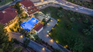 an overhead view of a house with a swimming pool at Porto Koufo Resort in Porto Koufo