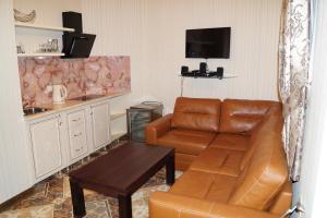 a living room with a couch and a table at Marianna Hotel in Sochi