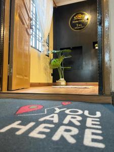 a welcome mat on the floor of a lobby at Homestay by Tas in Kulai