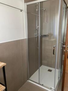 a shower with a glass door in a bathroom at Residence Antonio Vivaldi in Noventa di Piave