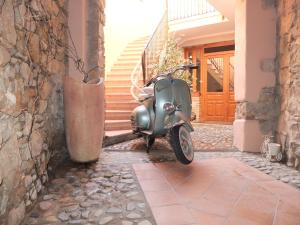 a vespa parked on the side of a building at Casa Camilla Sardegna in San Vito