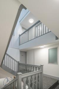 a staircase in a building with white walls at La Sauvage in Fribourg