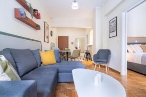 A seating area at Mar25 by Smart Cozy Suites - In the heart of Athens - 9 minutes from metro - Available 24hr