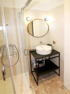 a bathroom with a sink and a mirror at Falcon Apartment Center 2 Metro Złote Tarasy in Warsaw